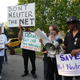 People demonstrate for net neutrality in the exclusive neighborhood of Bel-Air outside a USC Shoah Foundation fundraiser to be attended by President Barack Obama on May 7, 2014 in Los Angeles, California.